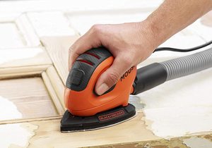 BLACK+DECKER 55W Mouse Sander in use.
