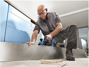 Bosch GHO 18 V-LI Professional Cordless Planer in use.