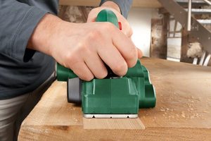 Bosch PHO 1500 Electric Planer in use.