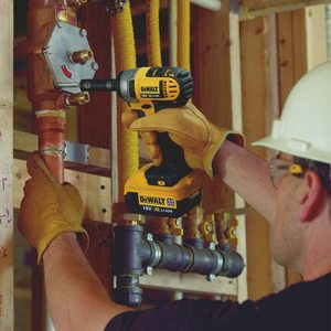 DEWALT DCF880N-XJ Cordless Impact Wrench in use.