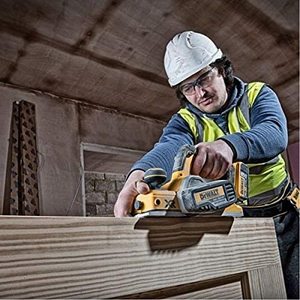 DEWALT DCP580N Cordless Planer in use.