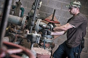 Ingersoll Rand 2135QXPA Impact Wrench in use.