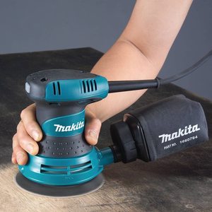 Makita BO5030 Random Orbit Sander in use.