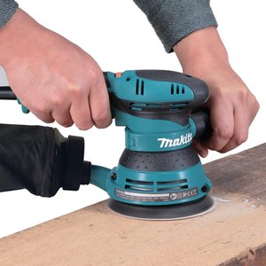 Makita BO5041 Random Orbit Sander in use.