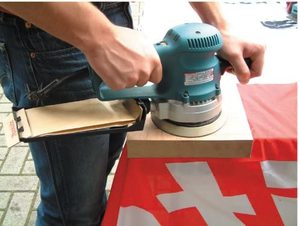 Makita BO6030 Random Orbit Sander in use.