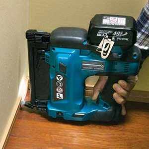 Makita DBN500ZJ Cordless Brad Nailer in use.