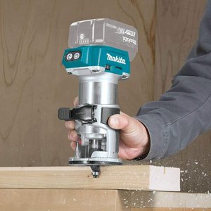 Makita DRT50ZJ Router in use.