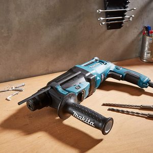 Makita HR2630 Rotary Hammer on a work bench.