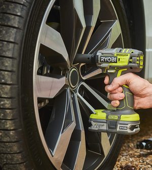 Ryobi R18IW7-0 18V Impact Wrench in use.