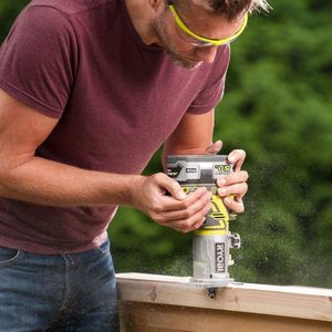 Ryobi R18TR-0 ONE+ Cordless Trim Router in use.