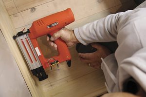 Tacwise 1183 Electric Nail Gun in use.